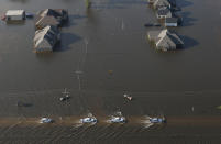 <p>Cars drive through flooded streets from Tropical Storm Harvey in Orange, Texas, Thursday, Aug. 31, 2017. (Photo: Gerald Herbert/AP) </p>