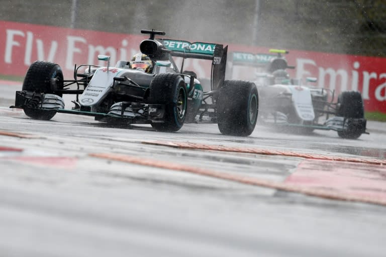 Mercedes driver Lewis Hamilton drives in front of Nico Rosberg during the qualifying session ahead of the Hungarian Grand Prix, on July 23, 2016