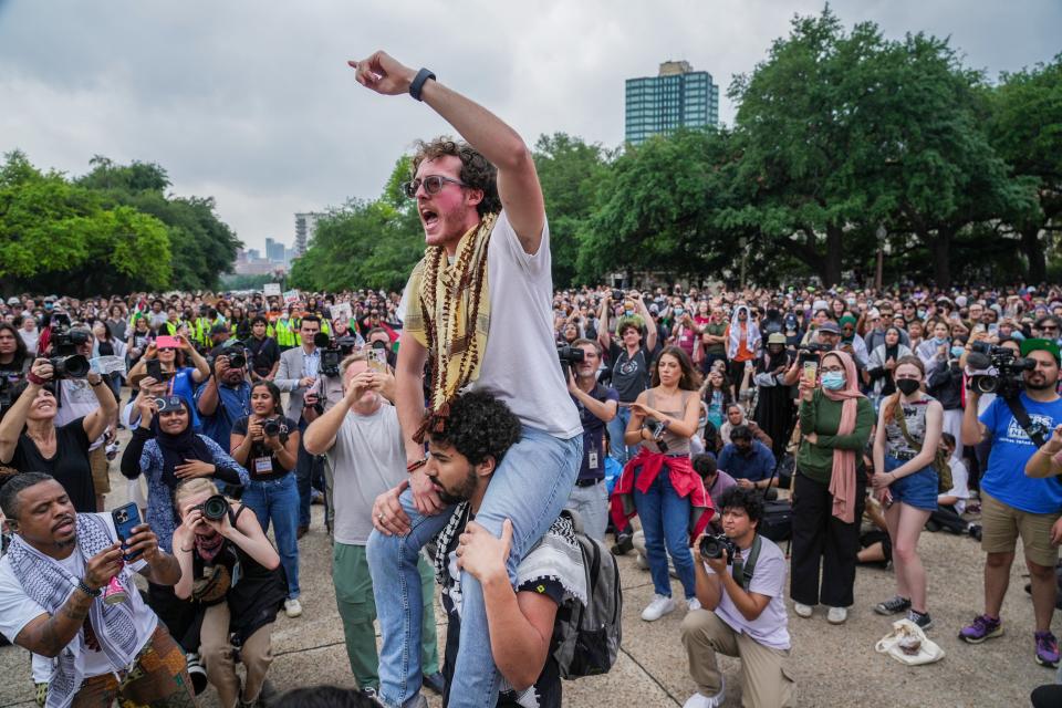 Ammer Qaddumi, one of the protesters arrested on Wednesday, April 24,2024, participates in a chant outside the Main Building on campus. Professors, students, and supporters of UT-Austin demonstrated on campus on Thursday, April 25, 2024