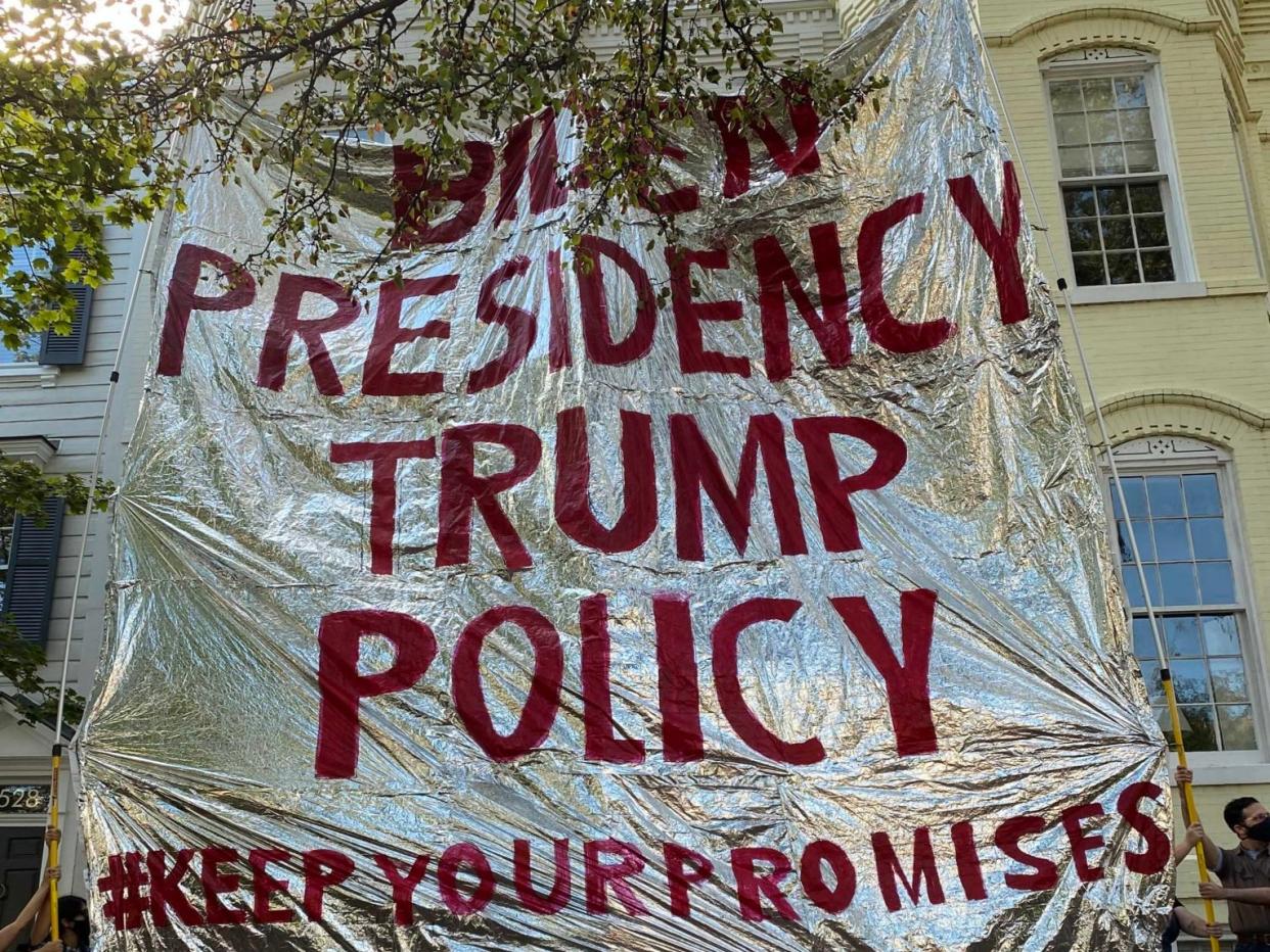 Protesters from Never Again Action hold up a gigantic foil emergency blanket outside the home of Homeland Security secretary Alejandro Mayorkas (Never Again Action / Twitter)