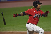 Cleveland Indians' Jose Ramirez watches his two-run double during the fifth inning of Game 2 of the team's American League wild-card baseball series against the New York Yankees, Wednesday, Sept. 30, 2020, in Cleveland. (AP Photo/David Dermer)
