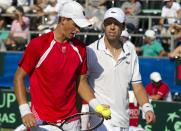 Canadian tennis player Daniel Nestor (R) and Vasek Pospisil (L) react after winning a point against Israeli tennis team players Jonathan Erlich and Andy Ram of Israel tennis team during their Davis Cup world group doubles playoff tennis match in Ramat Hasharon near Tel Aviv on September 17, 2011. AFP PHOTO/JACK GUEZ (Photo credit should read JACK GUEZ/AFP/Getty Images)