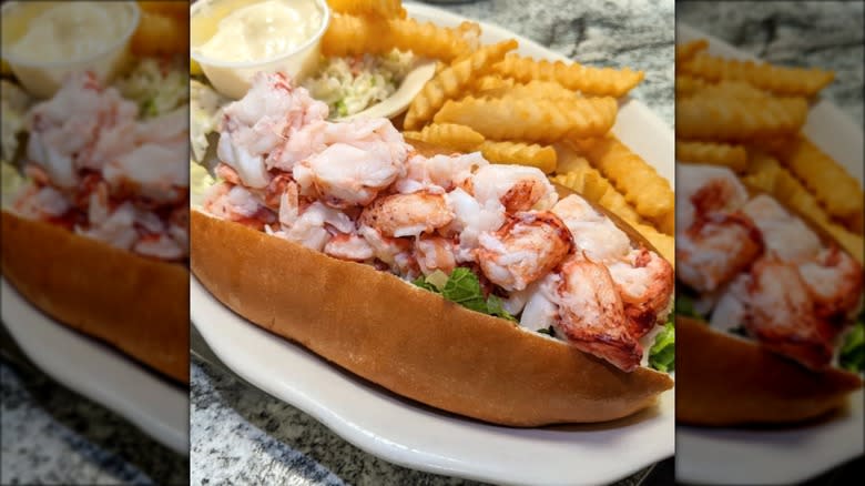 Fresh lobster roll with crinkle-cut fries