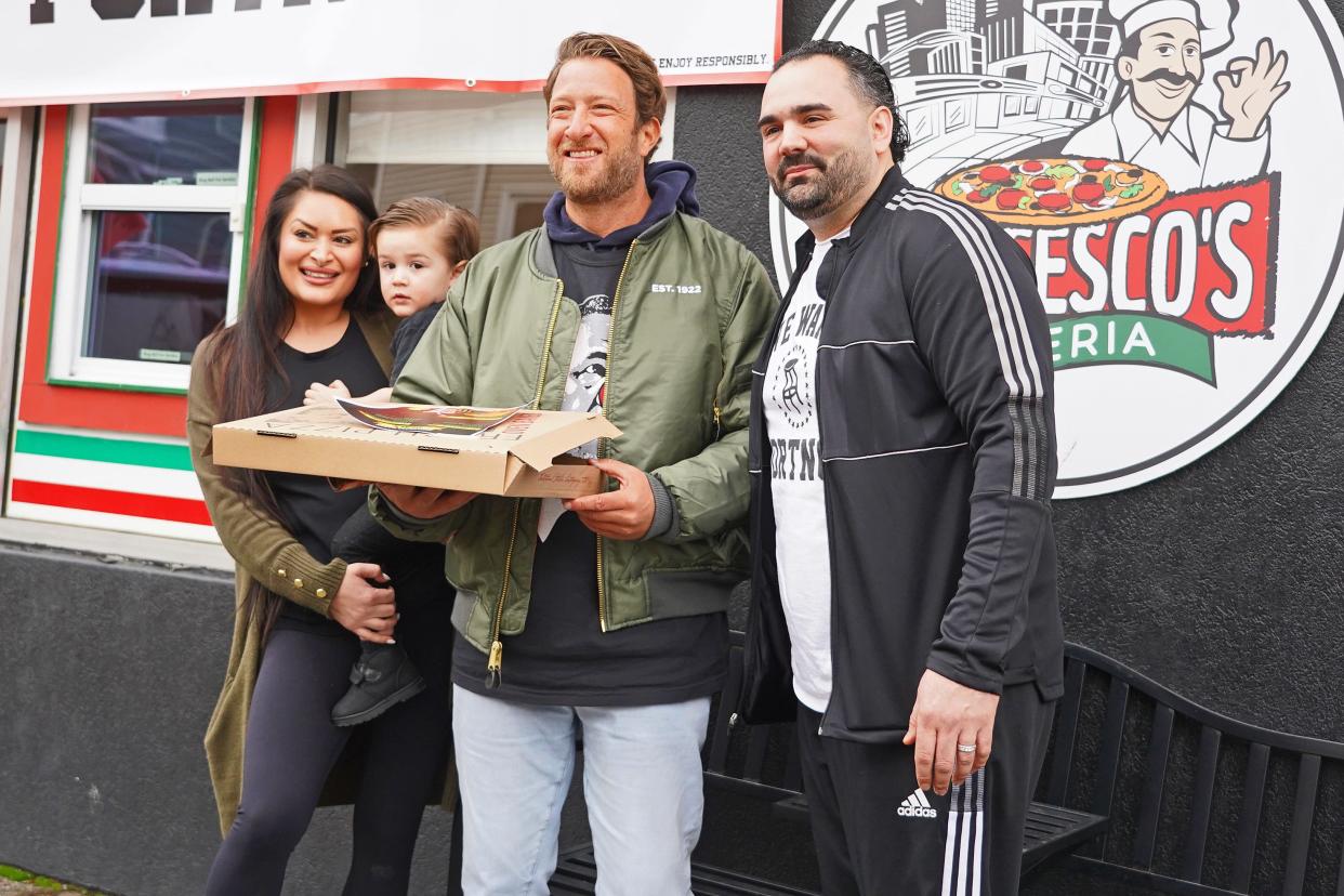 Dave Portnoy (center) poses with Francesco's Pizzeria owner Frank Schiavone (right), his wife Stephanie (left) and son Frankie.