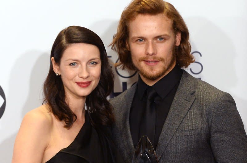 "Outlander" co-stars Caitriona Balfe (L) and Sam Heughan pose backstage at the People's Choice Awards at the Nokia Theatre in 2015. The casting for a prequel series was announced Monday. File Photo by Jim Ruymen/UPI