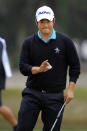 John Huh waves to the crowd after making a par putt on the seventh green during the third round of the RBC Heritage golf tournament in Hilton Head Island, S.C., Saturday, April 19, 2014. (AP Photo/Stephen B. Morton)