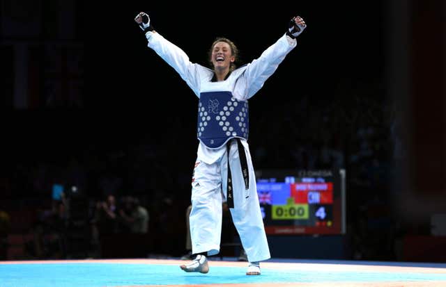 Jade Jones celebrates her first Olympic gold with her arms aloft in London 2012.