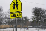 Icicles hang from a road sign Wednesday, Feb. 1, 2023, in Dallas. (AP Photo/Tony Gutierrez)