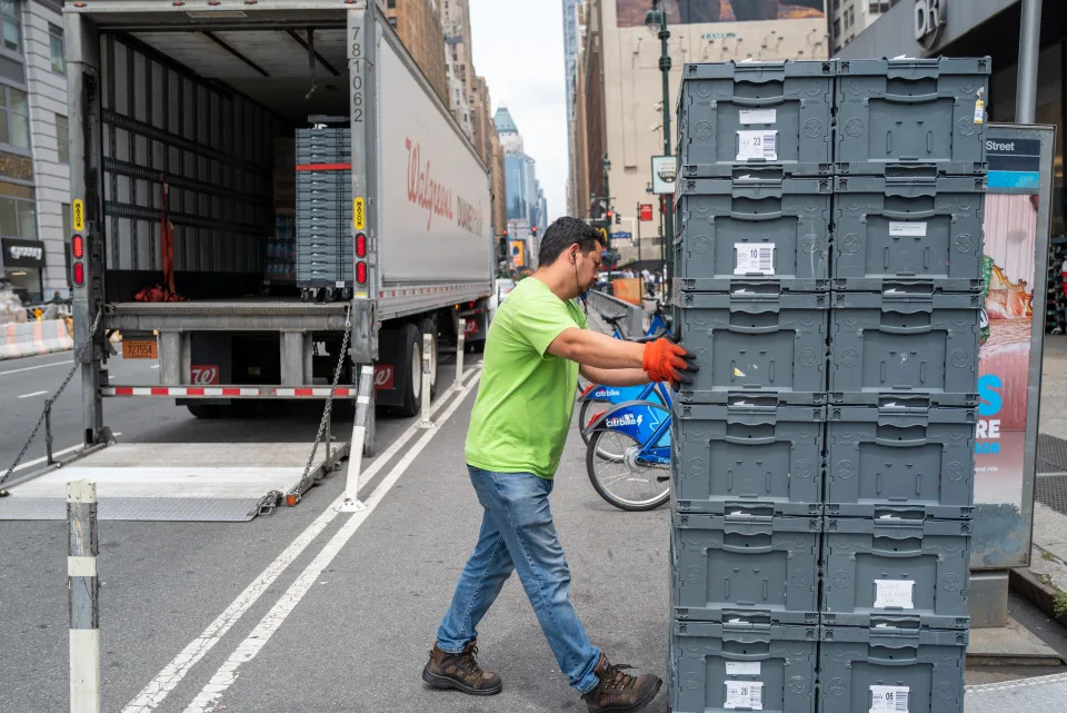 NEW YORK, NEW YORK - JULY 28: A man moves merchandise from a truck in Manhattan on July 28, 2022 in New York City. The Commerce Department said on Thursday that the nation's Gross Domestic Product (GDP) fell 0.2 percent in the second quarter. With two GDP declines in a row, many economists fear that the United States could be entering a recession.  (Photo by Spencer Platt/Getty Images