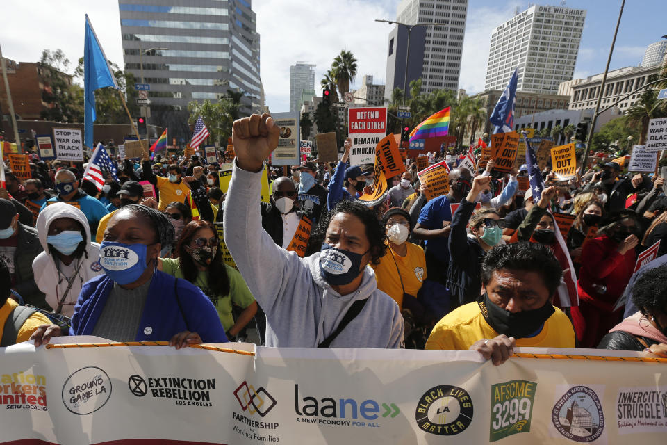 Demonstrators in Los Angeles march to advocate protecting the voting results after Democratic presidential candidate Joe Biden was announced as the winner. (AP Photo/Ringo H.W. Chiu)