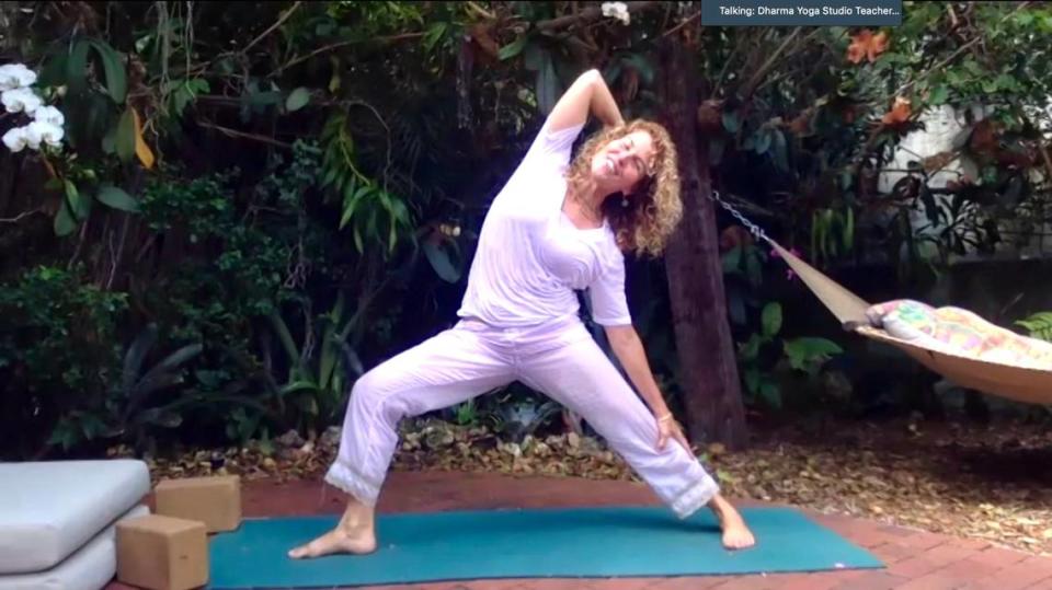 Natalie Morales, who founded Dharma Yoga Studio on Thanksgiving Day in 2009, livestreams a ‘funyasa’ yoga class from her backyard.