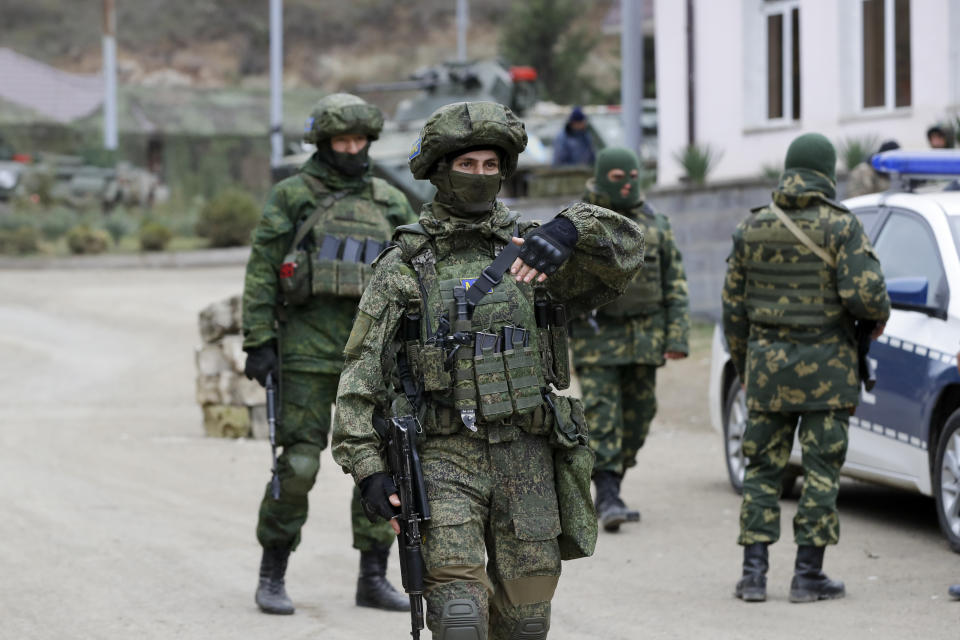 Russian peacekeepers patrol an aria in Stepanakert, the separatist region of Nagorno-Karabakh, on Sunday, Nov. 15, 2020. Ethnic Armenian forces had controlled Nagorno-Karabakh and sizeable adjacent territories since the 1994 end of a separatist war. Fighting resumed in late September and have now ended with an agreement that calls for Azerbaijan to regain control of the outlying territories as well as allowing it to hold on to parts of Nagorno-Karabakh that it seized during the fighting. (AP Photo/Sergei Grits)