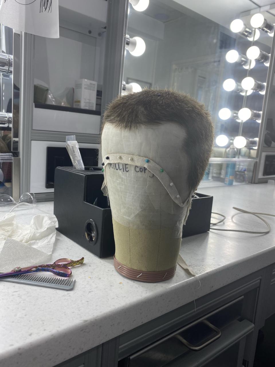 Millie Bobby Brown’s buzz cut wig for Eleven in STRANGER THINGS. Courtesy of Sarah Hindsgaul - Credit: Courtesy of Sarah Hindsgaul