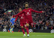 Liverpool's Mohamed Salah celebrates after scoring his side's opening goal during the English Premier League soccer match between Liverpool and Manchester City at Anfield stadium in Liverpool, Sunday, Oct. 16, 2022. (Peter Byrne/PA via AP)