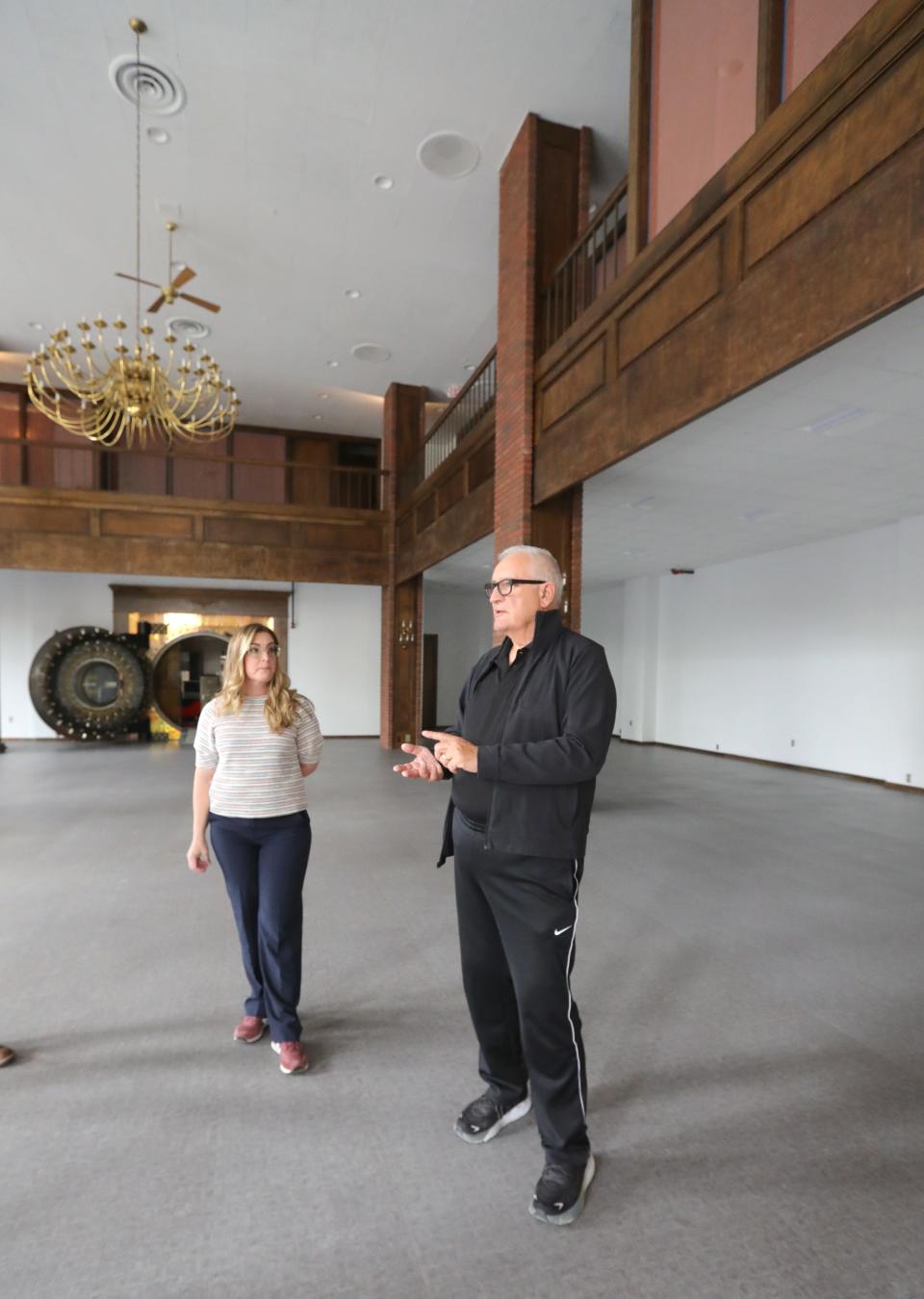 Commercial Property Partners CEO Gerilyn Gleason, left, and 159 Main owner Tom Rybak give a tour of the building at 159 S. Main Street.