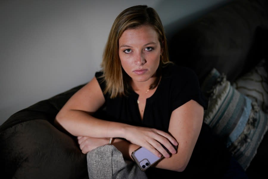 Shannon Keeler poses for a portrait in the United States on Wednesday, April 7, 2021. An American accused of sexually assaulting Keeler at a Pennsylvania college in 2013 and later sending her a Facebook message that said, “So I raped you,” has been detained in France after a three-year search. (AP Photo/Chris Carlson, File)