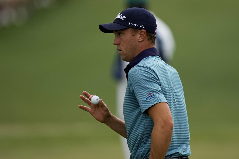 Justin Thomas holds up his ball after putting on the 16th hole during the second round of the Masters golf tournament on Friday, April 9, 2021, in Augusta, Ga. (AP Photo/Matt Slocum)