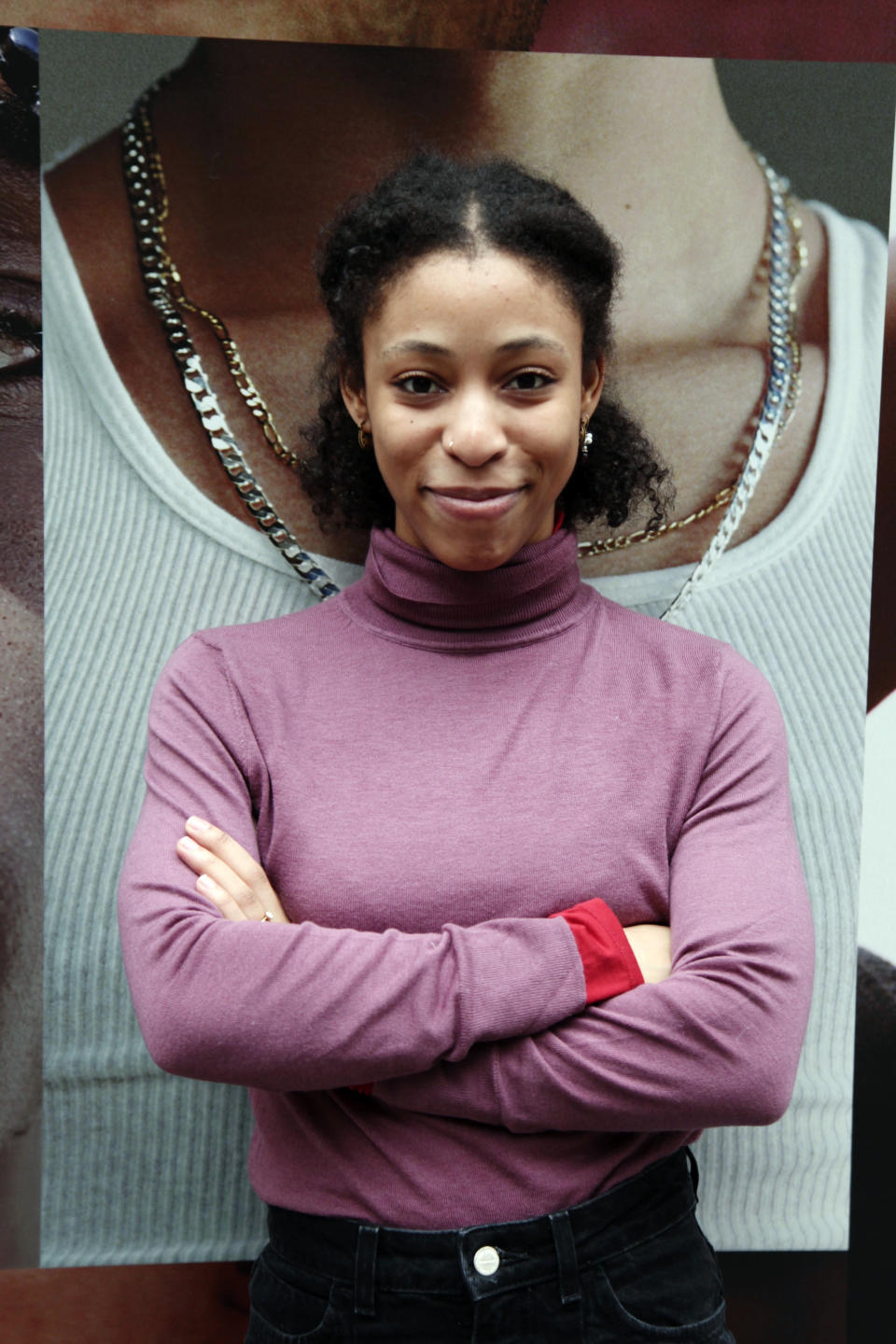 In this Tuesday, Feb. 18, 2020 photo, Satori Folkes-Stone poses outside the Broadway Theatre in New York, where she is making her Broadway debut in "West Side Story." The revival opens Thursday night and boasts 33 young people making their Broadway debuts. (Lisa Tolin via AP)