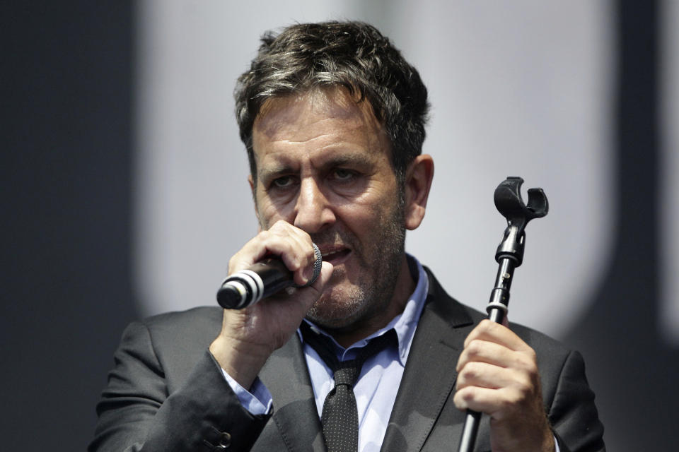 Musician Terry Hall of The Specials performs on the Main Stage, at the Isle of Wight Festival in Seaclose Park, Newport, Isle of Wight, England, on June 14, 2014. Hall, the lead singer of The Specials, died at the age of 63 following a brief illness, the band announced late Monday, Dec. 19, 2022. (Yui Mok/PA via AP)