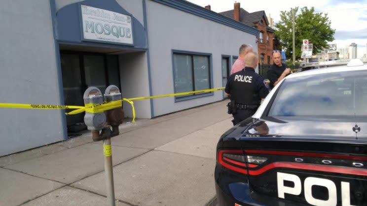 Police at the scene of a suspected arson attack against a Hamilton mosque earlier in September. From CBC.