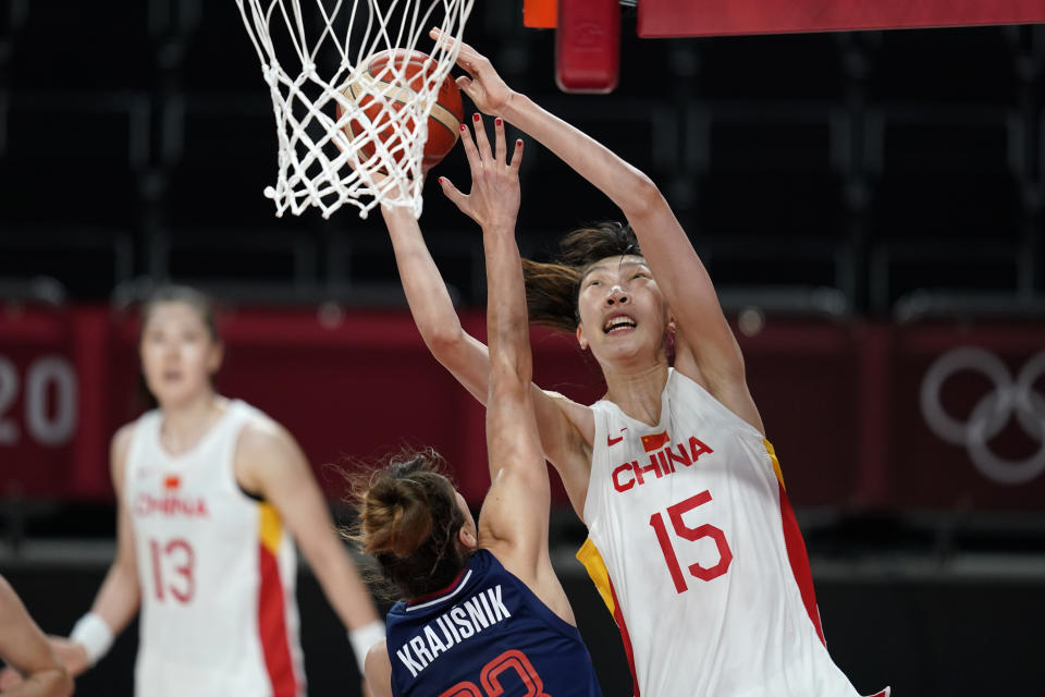 FILE - China's Han Xu (15) shoots over Serbia's Tina Krajisnik during a women's basketball quarterfinal at the 2020 Summer Olympics, Aug. 4, 2021, in Saitama, Japan. Chinese fans became aware of Han and Li Yueru during their stints with the Olympic team that finished fifth in Tokyo. But their fan base has grown since both were drafted in 2019 — Han in the second round, Li in the third. (AP Photo/Charlie Neibergall, File)