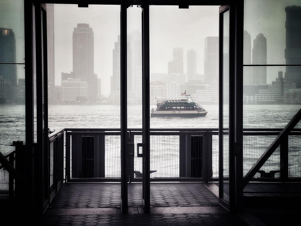 A ferry boat is framed in the doors of a passenger ferry pier, as it motors up the Hudson River on a foggy afternoon in the New York City area in this Wednesday, June 22, 2022 photo taken with an iPhone. "I still carry a professional high resolution camera most places but the ease of the iPhone to snap and share via text message means my family and friends get see what I see at almost the moment I see it," wrote Ake. (AP Photo/J. David Ake)