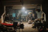 In this photo provided by Azov Special Forces Regiment of the Ukrainian National Guard Press Office, Ukrainian soldiers inside the ruined Azovstal steel plant in their shelter in Mariupol, Ukraine, May 7, 2022. For nearly three months, Azovstal’s garrison clung on, refusing to be winkled out from the tunnels and bunkers under the ruins of the labyrinthine mill. A Ukrainian soldier-photographer documented the events and sent them to the world. Now he is a prisoner of the Russians. His photos are his legacy.(Dmytro Kozatski/Azov Special Forces Regiment of the Ukrainian National Guard Press Office via AP)