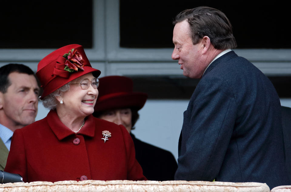 CHELTENHAM, UNITED KINGDOM - MARCH 13: (EMBARGOED FOR PUBLICATION IN UK NEWSPAPERS UNTIL 24 HOURS AFTER CREATE DATE AND TIME) Queen Elizabeth II accompanied by trainer Nicky Henderson watches her horse 'Barbers Shop' run in the Gold Cup on day 4 'Gold Cup Day' of the Cheltenham Festival at Cheltenham Racecourse on March 13, 2009 in Cheltenham, England. (Photo by Max Mumby/Indigo/Getty Images)