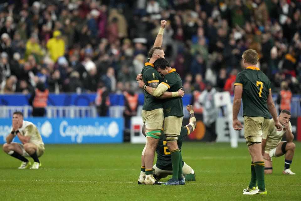 South Africa's player celebrate after winning the Rugby World Cup semifinal match between England and South Africa at the Stade de France in Saint-Denis, outside Paris, Saturday, Oct. 21, 2023. (AP Photo/Pavel Golovkin)