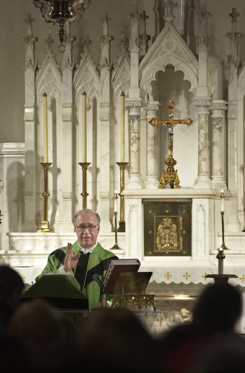 In this 2007 file photo, the Rev. James Garisto conducts mass at Our Lady of Rosary Chapel.