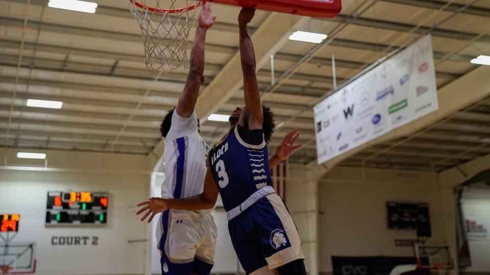 Lloyd's Isaiah Sebastian (3) drives to the basket while IMG Academy's Jacob Hammond defends in a game between the Juggernauts and Ascenders at the Griffin Elite Basketball Classic at Griffin Elite Sports & Wellness in Erlanger, KY on Dec. 16, 2023.