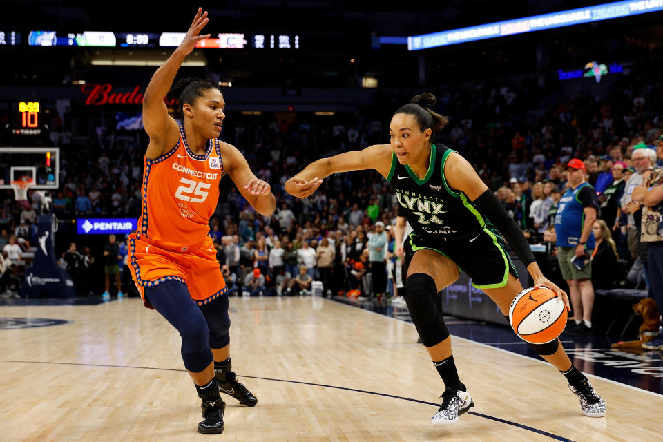 MINNEAPOLIS, MINNESOTA – OCTOBER 01: Napheesa Collier #24 of the Minnesota Lynx drives to the basket against Alyssa Thomas #25 of the Connecticut Sun in the first quarter of game two of the semifinals during the WNBA playoffs at Target Center on October 01, 2024 in Minneapolis, Minnesota. NOTE TO USER: User expressly acknowledges and agrees that by downloading and/or using this photograph, User is agreeing to the terms and conditions of the Getty Images License Agreement. (Photo by David Berding/Getty Images)