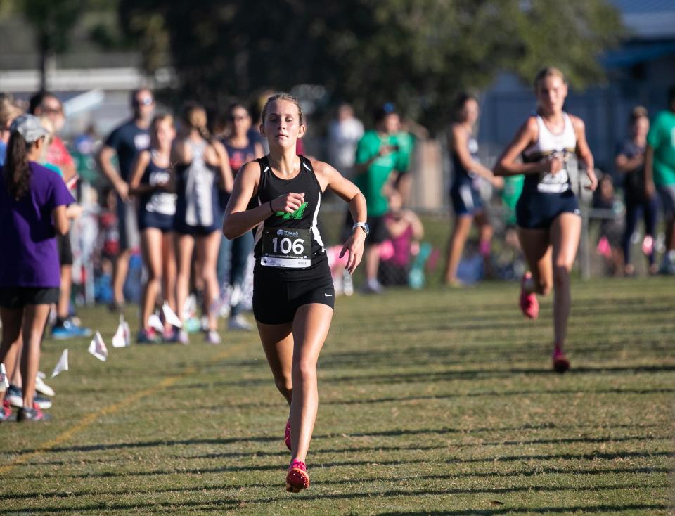 Masha Dorofeev of Fort Myers comes to the finish line in third place followed by Tara Watkins of Naples at the 3A Region 3 Cross Country Championships on Thursday, Nov. 9, 2023, at Buckingham Community Park in Fort Myers. Two runners from Osceola took first and second place in the race. In the team compeition, Osceola won first, Naples won second and Fort Myers got third.