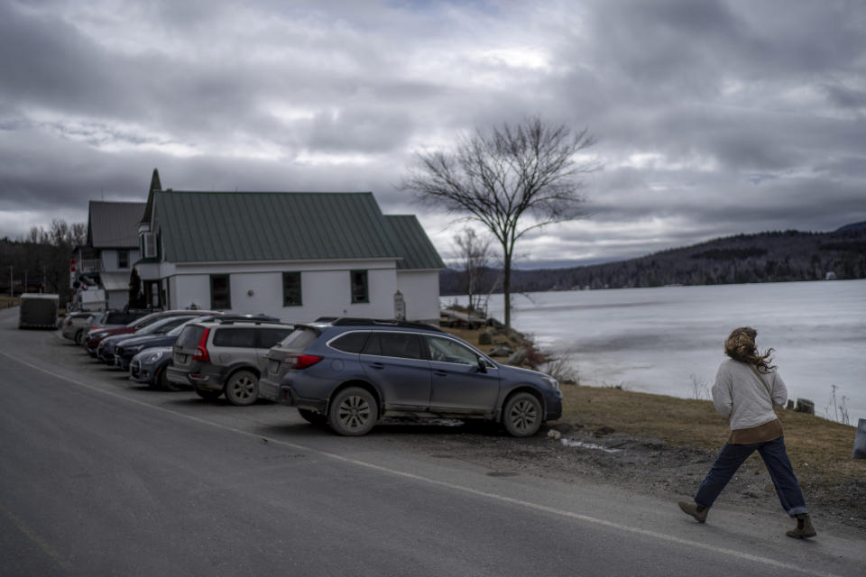 A resident walks to the town hall to attend the annual Town Meeting in Elmore, Vt., Tuesday, March 5, 2024. The tradition is under threat, with many people feeling they don't have the time or ability to attend. Many towns in Vermont have elected to move to a secret ballot system similar to the system used in national elections. (AP Photo/David Goldman)