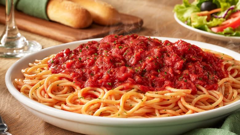 spaghetti topped with marinara sauce