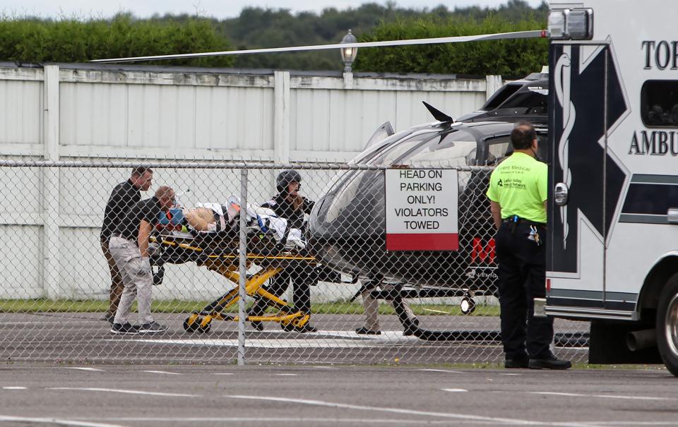 Verizon IndyCar Series driver Robert Wickens is loaded on to a helicopter to be taken to a local hospital following an accident during the ABC Supply 500 at Pocono Raceway.