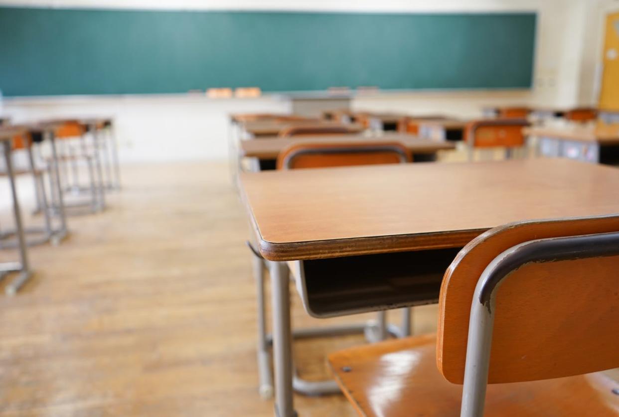 Students who miss a lot of school are more likely to drop out. <a href="https://www.gettyimages.com/detail/photo/school-classroom-with-blackboard-royalty-free-image/637549064?phrase=empty+high+school+classroom" rel="nofollow noopener" target="_blank" data-ylk="slk:maroke/iStock via Getty Images Plus;elm:context_link;itc:0;sec:content-canvas" class="link ">maroke/iStock via Getty Images Plus</a>