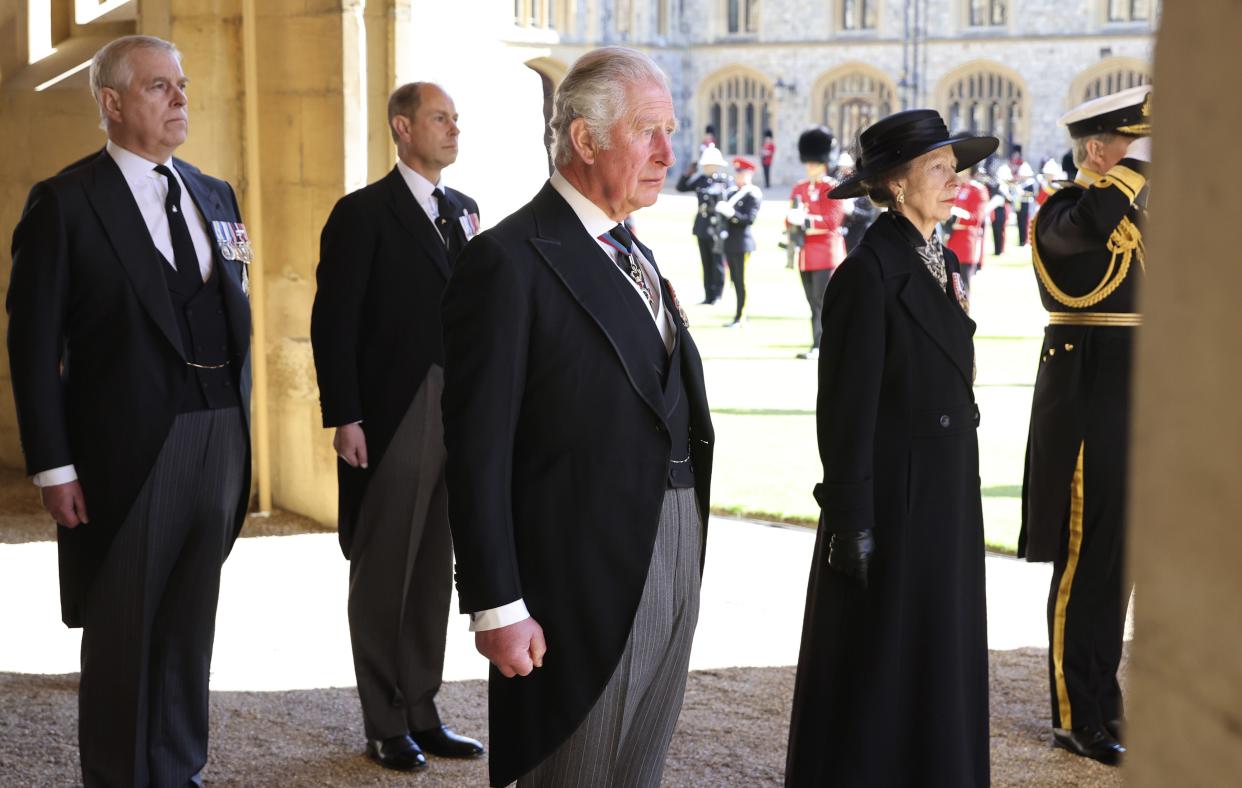 From left, Prince Andrew, Prince Edward, Prince Charles and Princess Anne arrive after walking in a procession behind the coffin of Prince Philip, with other members of the Royal family during the funeral of Britain's Prince Philip inside Windsor Castle in Windsor, England, Saturday, April 17, 2021.