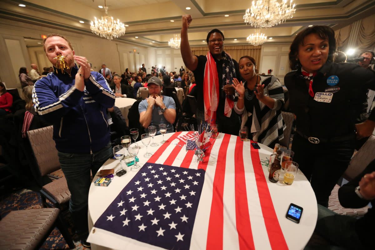 People cheer as the Democrats Abroad gather Canadian Democrats celebrat early Obama returns at the Sheraton in Toronto for the American election. (Steve Russell/Toronto Star via Getty Images)