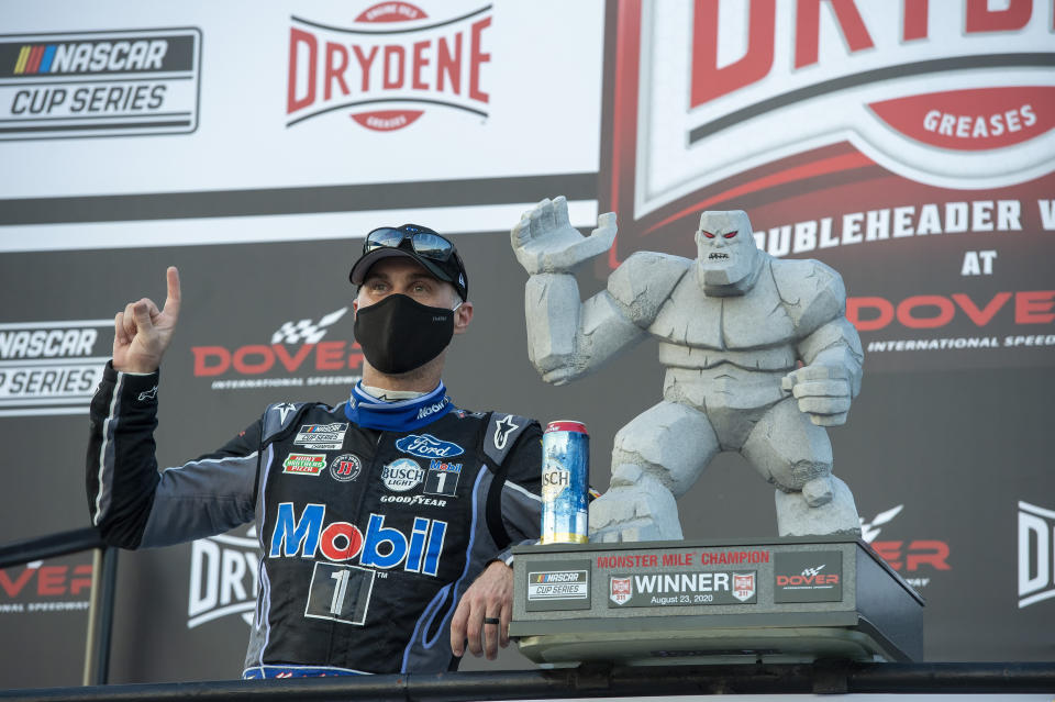 Kevin Harvick celebrates after winning a NASCAR Cup Series auto race at Dover International Speedway, Sunday, Aug. 23, 2020, in Dover, Del. (AP Photo/Jason Minto)