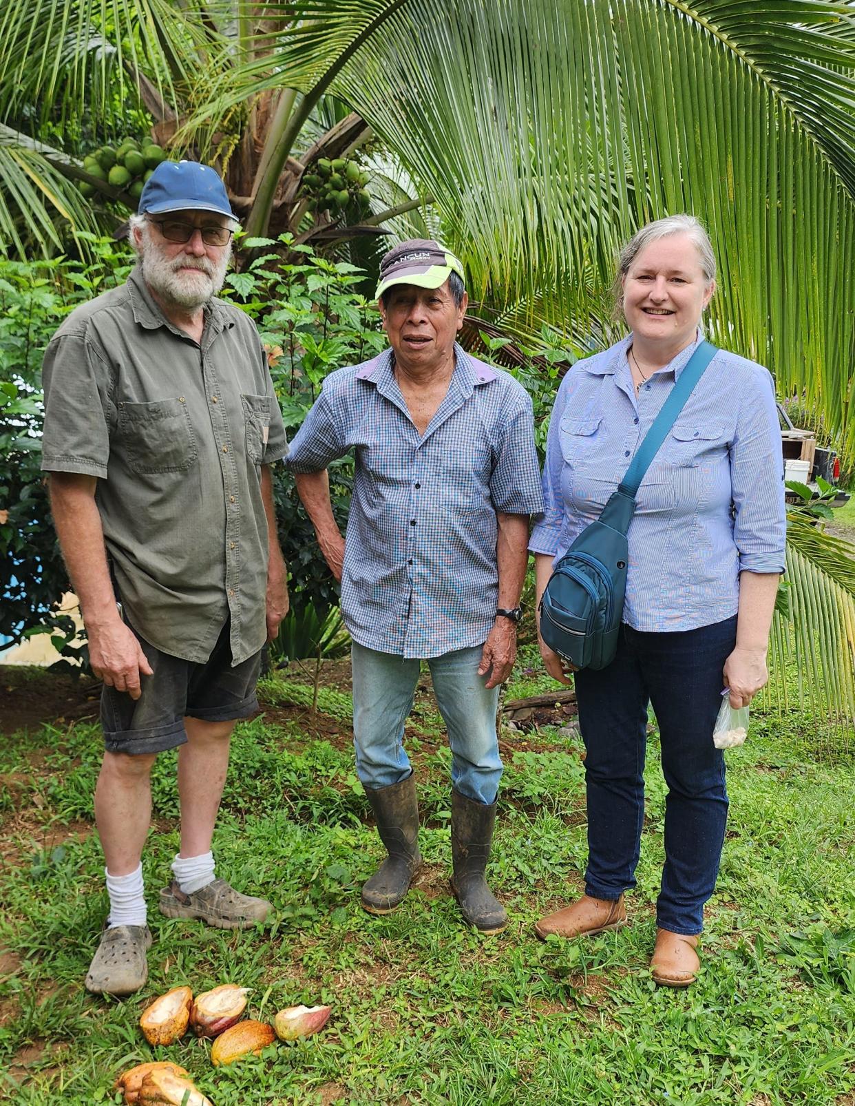 Mark Roth, left, and Sarah Uhing, right, stand with one of the Costa Rican farmers they source cacao beans from for their bar-to-bean chocolate company, Captain's Chocolate.