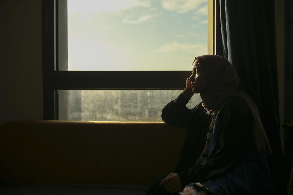 Uyghur Nursimangul Abdureshid, 34, poses for a photograph during an interview with The Associated Press in Istanbul, Turkey on May 4, 2022. Nearly one in 25 people in a county in the Uyghur heartland of China has been sentenced to prison on terrorism-related charges, in what is the highest known imprisonment rate in the world, an Associated Press review of leaked data shows. Abdureshid's brother, Memetali Abdureshid, who ran a car repair shop, was listed as being sentenced to 15 years and 11 months in prison on charges of "picking quarrels and provoking trouble” and “preparing to carry out terrorist activities." (AP Photo/Emrah Gurel)