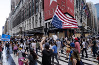 Activists move along W. 34th Street, Saturday, June 6, 2020, in New York. Protests continued following the death of George Floyd who died after being restrained by Minneapolis police officers on May 25. (AP Photo/Craig Ruttle)