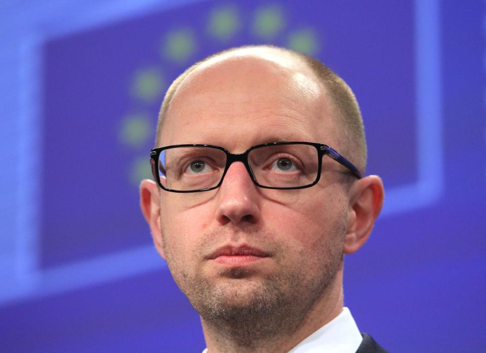 Ukrainian Prime Minister Arseniy Yatsenyuk addresses the media at the European Commission headquarters in Brussels, Tuesday, May 13, 2014. The European Commission says it is determined to help Ukraine, and to make sure that Ukraine has all the support it needs, to undertake the political and economic reforms that are necessary for the country. (AP Photo/Yves Logghe)