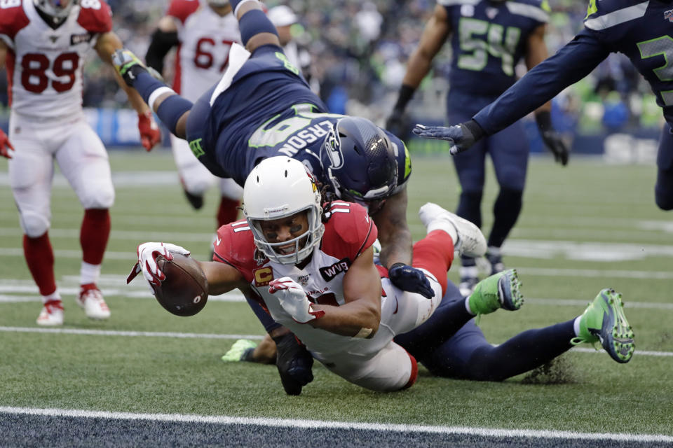 Arizona Cardinals wide receiver Larry Fitzgerald (11) scores a touchdown against the Seahawks. (AP Photo/Elaine Thompson)