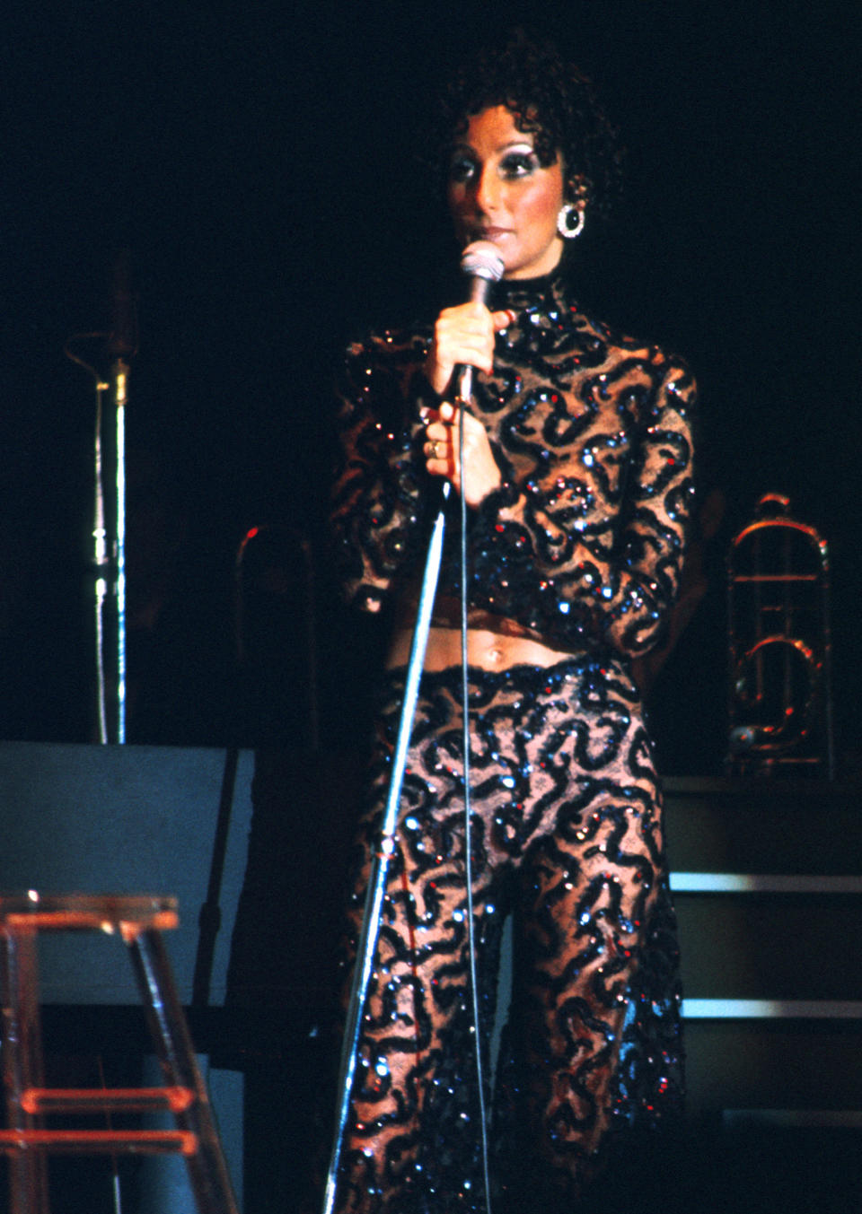 Cher performing onstage.