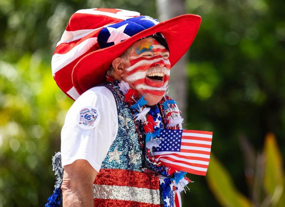 Grand Marshal of the Key Biscayne 4th of July parade, Tim Stickney, laughs after hyping up the crowd at the Independence Day celebration on Thursday, July 4, 2024 in Key Biscayne, Fla.