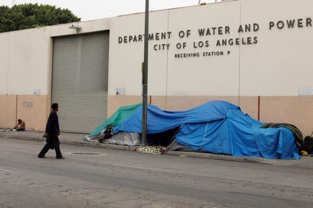 Tents and tarps erected by homeless people are shown along the sidewalks in the skid row area of downtown Los Angeles, California