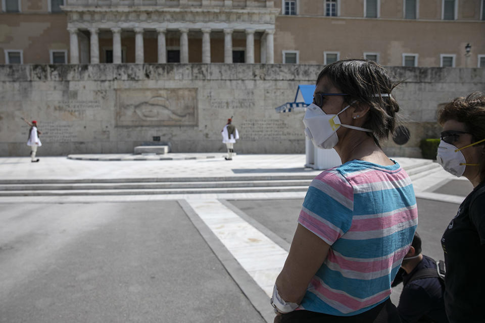 Tourists outside the Greek Parliament in Athens in March.