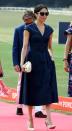 <p>To show her support for Prince Harry at the <span class="redactor-unlink">Sentebale ISPS Handa Polo Cup</span>, Meghan wore a V-neckline denim midi dress by Carolina Herrera with a belt that cinched in her waist. </p><p>The 36-year-old accessorised her look with a <span class="redactor-unlink">basket clutch by J. Crew</span>, Tom Ford sunglasses, and her favourite <span class="redactor-unlink">Aquazzura Deneuve slingback heels. </span></p>